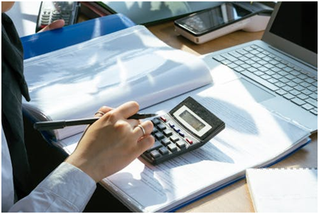 A person using a calculator