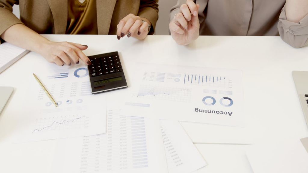 professionals reviewing financial charts and graphs for KPI tracking and strategic financial planning 