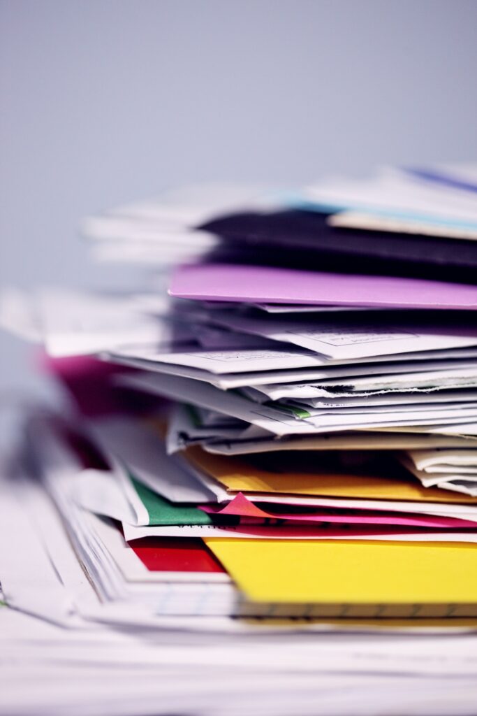 A pile of colorful papers and files