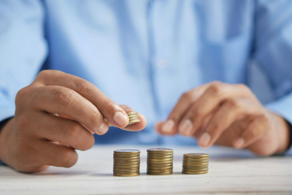 A man stacking coins