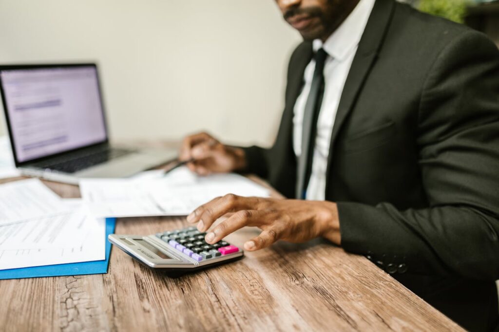 An accountant using calculator