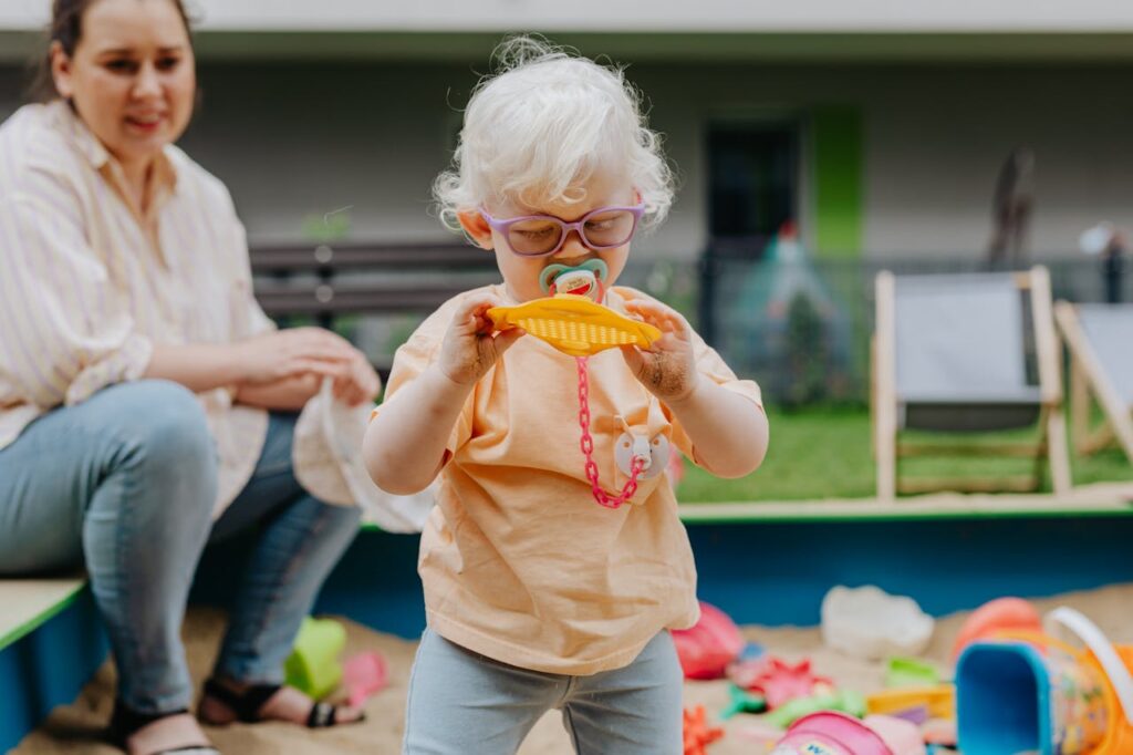 young girl with glasses playing